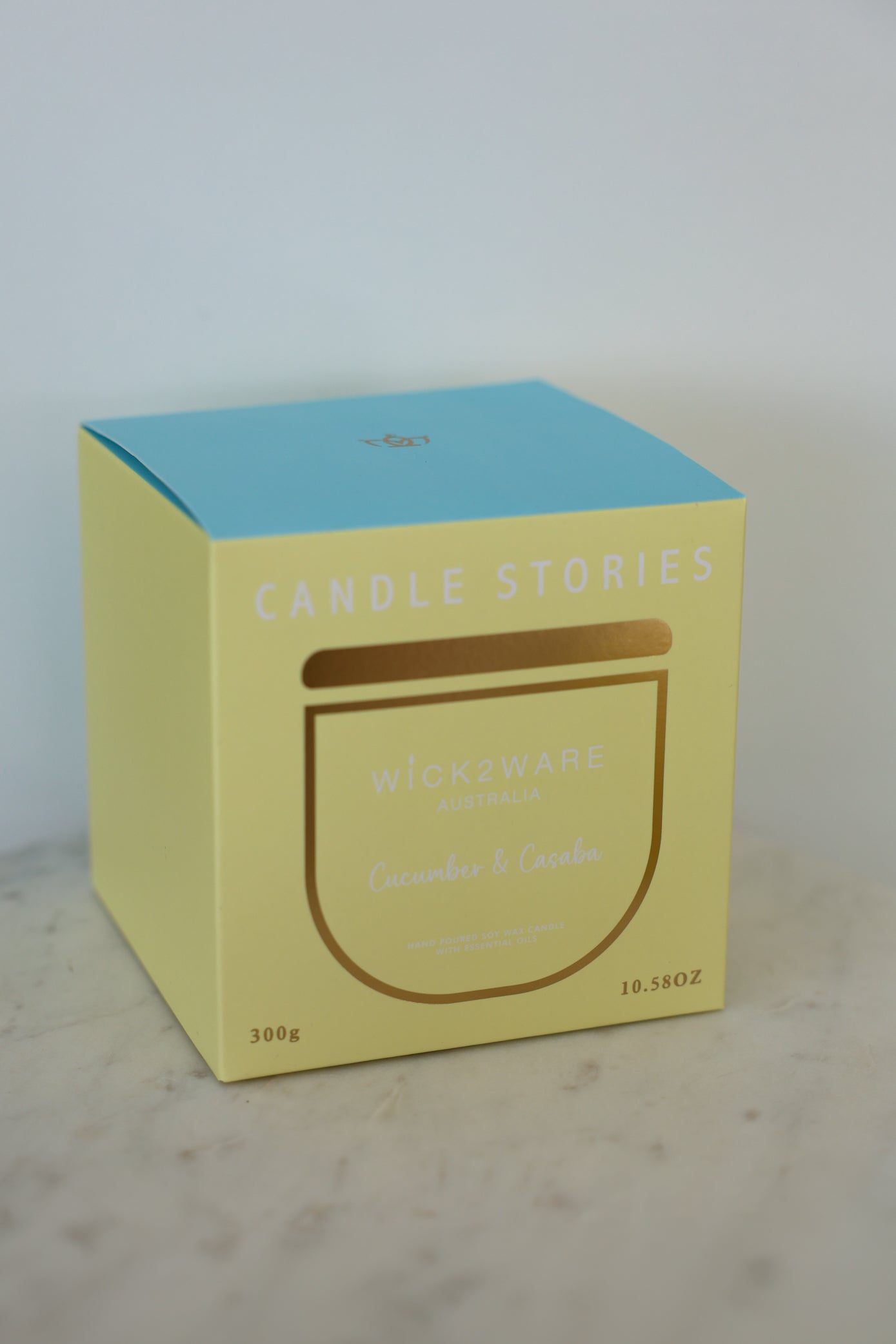 Cucumber & Casaba candle packaging – yellow and blue gift box by Wick2Ware