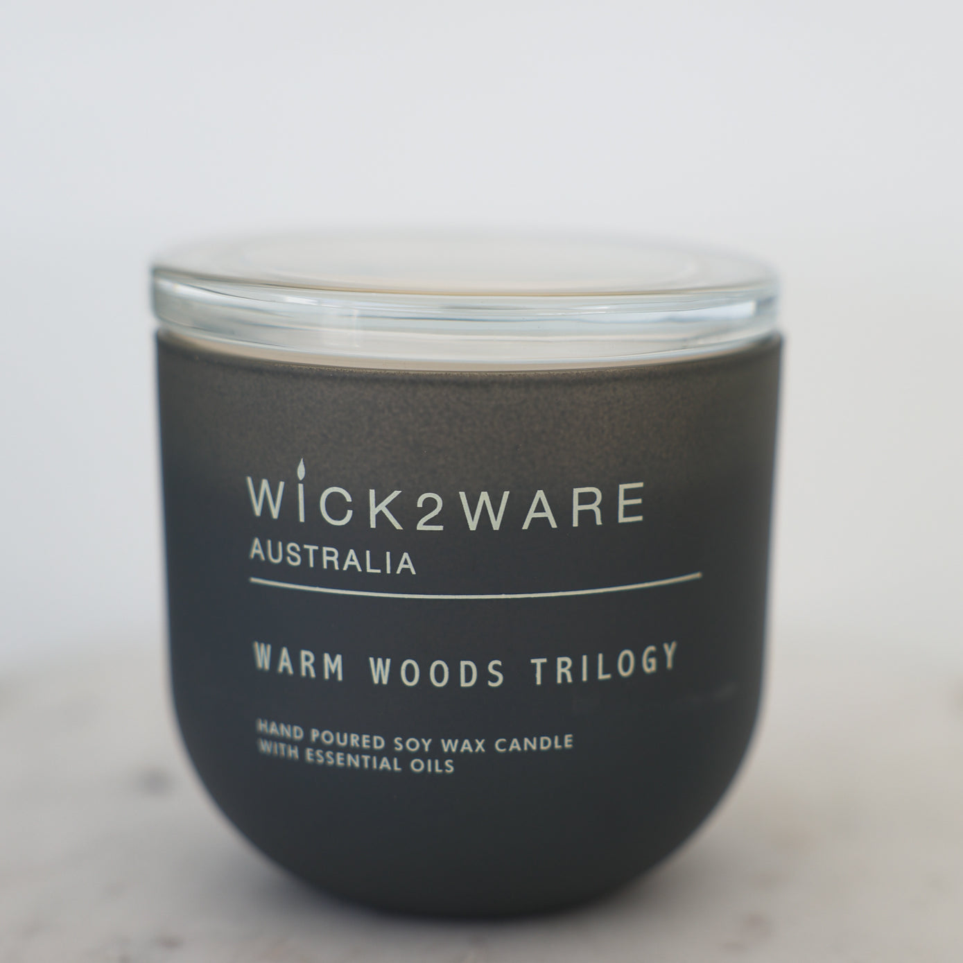 “Matte black soy wax candle with lid – Warm Woods Trilogy”